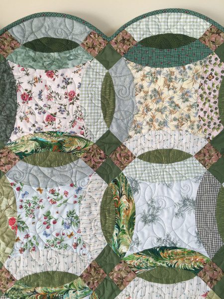 Double Wedding Ring Quilt in scrappy greens and florals